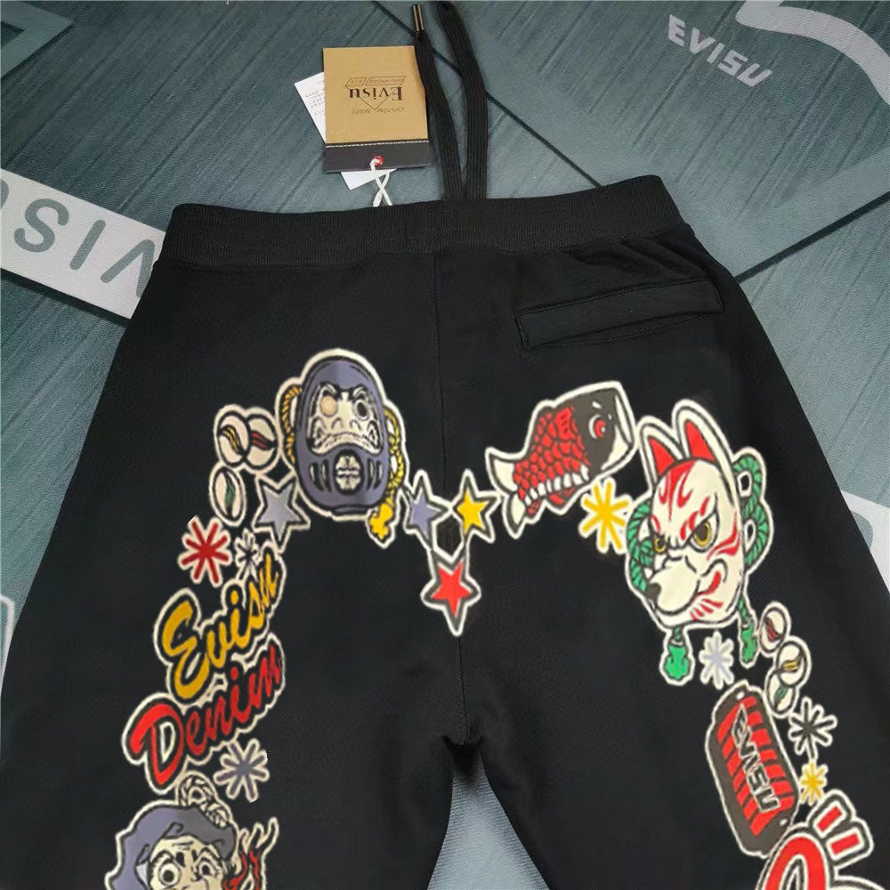 EVISU Denim Kitsune Daruma Sticker Collage M-Logo Graphic Jogger Sweatpants