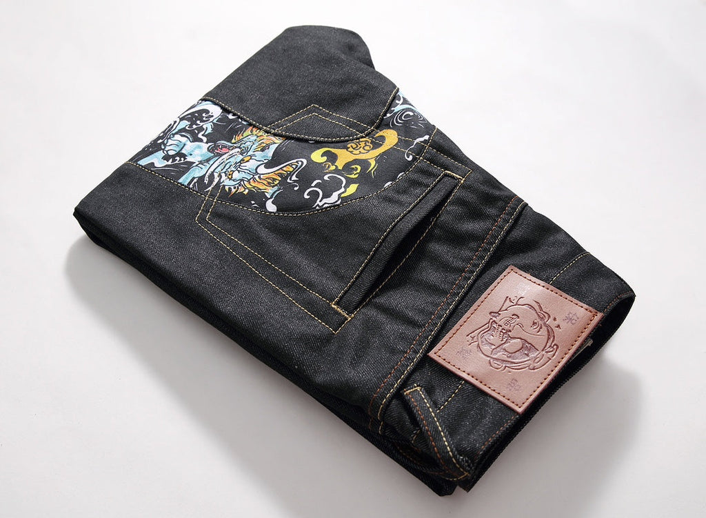 EVISU KURO Daicock Tiger & Foo Dog Print Appliqué Panel Jeans Wide Relaxed Fit Raw Selvedge Dark Indigo