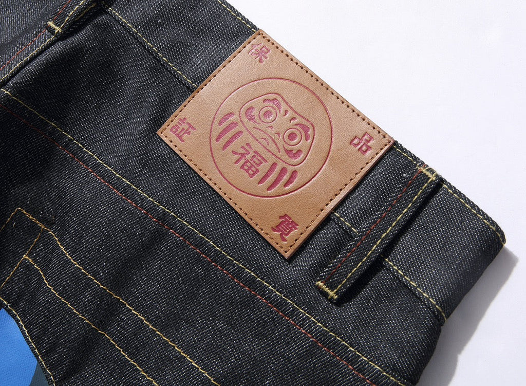 EVISU KURO Daicock Blue Yellow Camo Sakura Kamon Appliqué Panel Jeans Wide Fit Raw Selvedge Dark Indigo